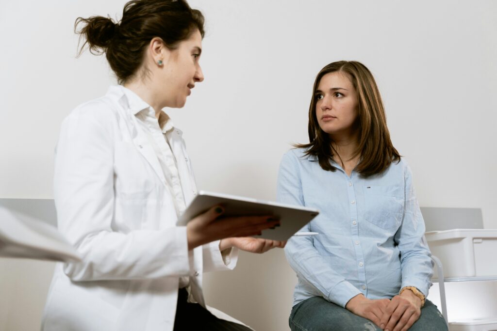 an ob-gyn is talking to a patient